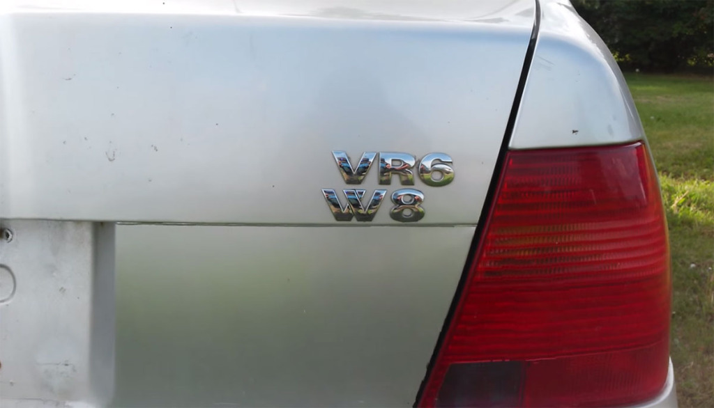 VW VR6 and W8 badges on back of twin-engine Jetta