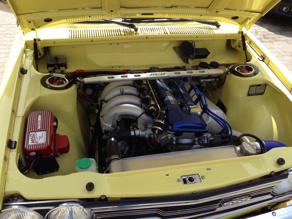 turbocharged Nissan KA24DE inside Datsun 510 engine bay