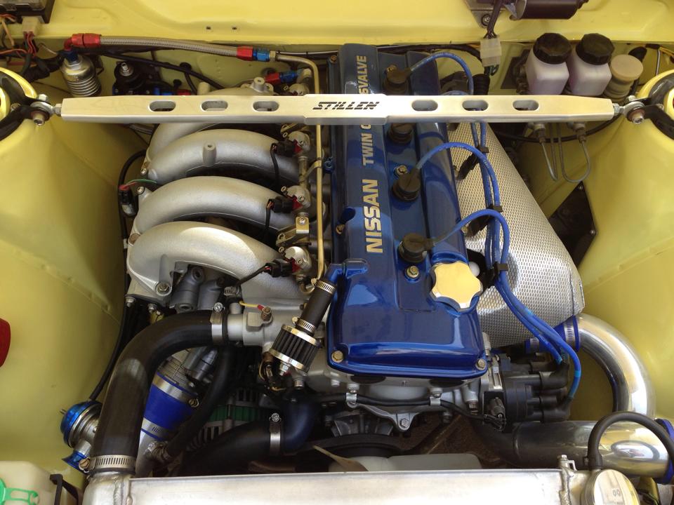 turbocharged Nissan KA24DE inside Datsun 510 engine bay