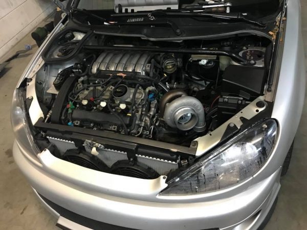 Peugeot 206 with a turbo V6 and Golf R32 4WD drivetrain